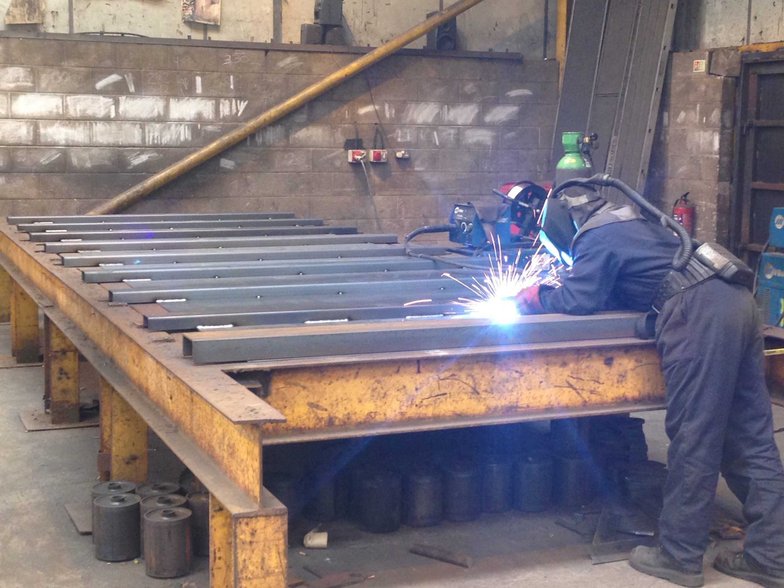 Welder creating heavy duty side for RORO