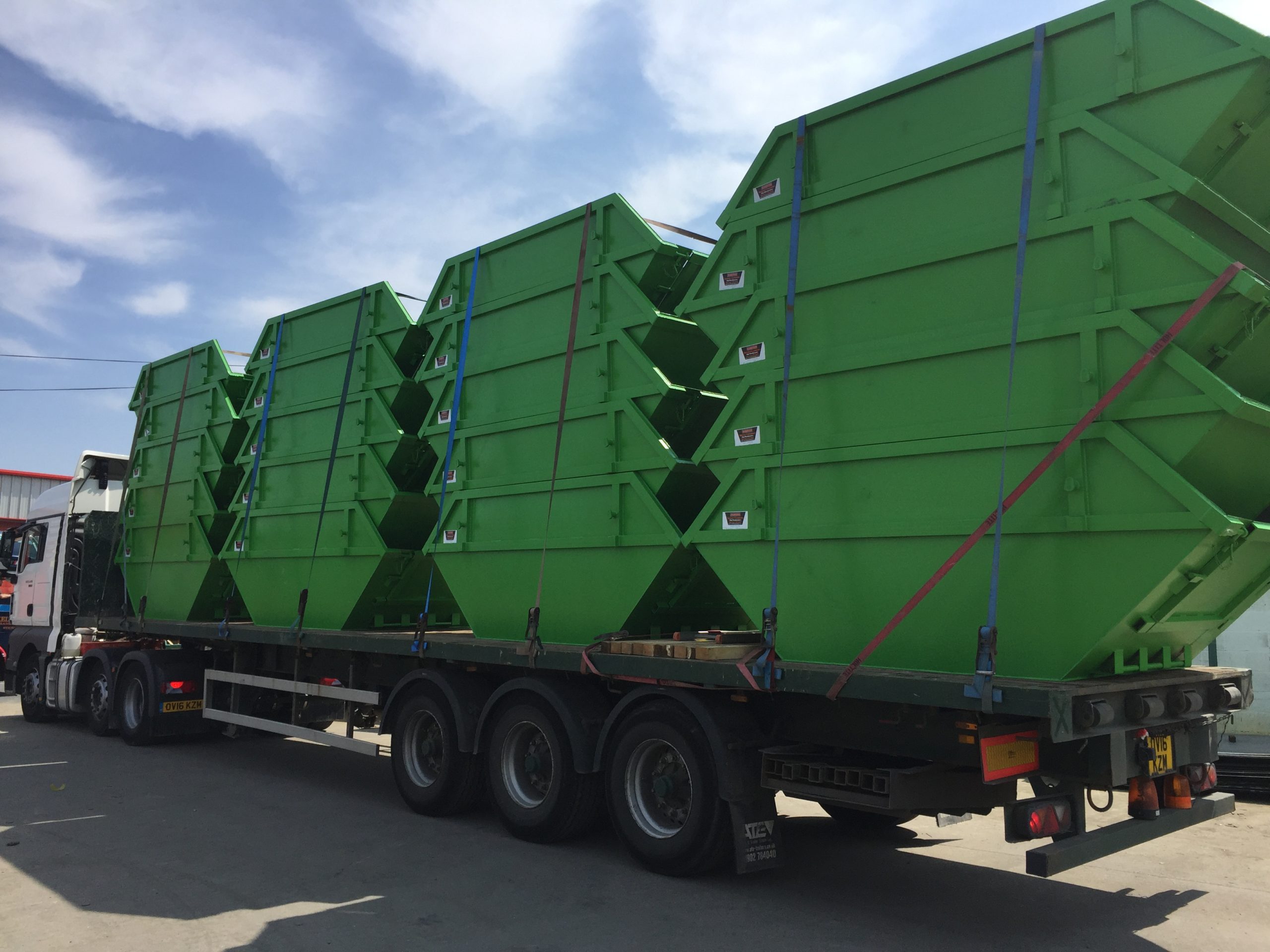 Loaded lorry full of bespoke skips